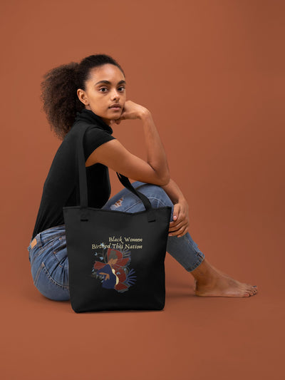 black mother being patriotic with tote bag showing black maternity picture and says birthed this nation to commemorate black history and the contributions of african american people.  it is in fourth of july colors